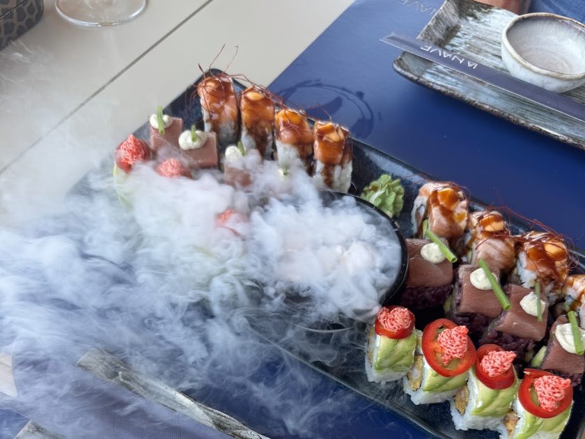 Sushi platter served under a cloud of dry ice vapour